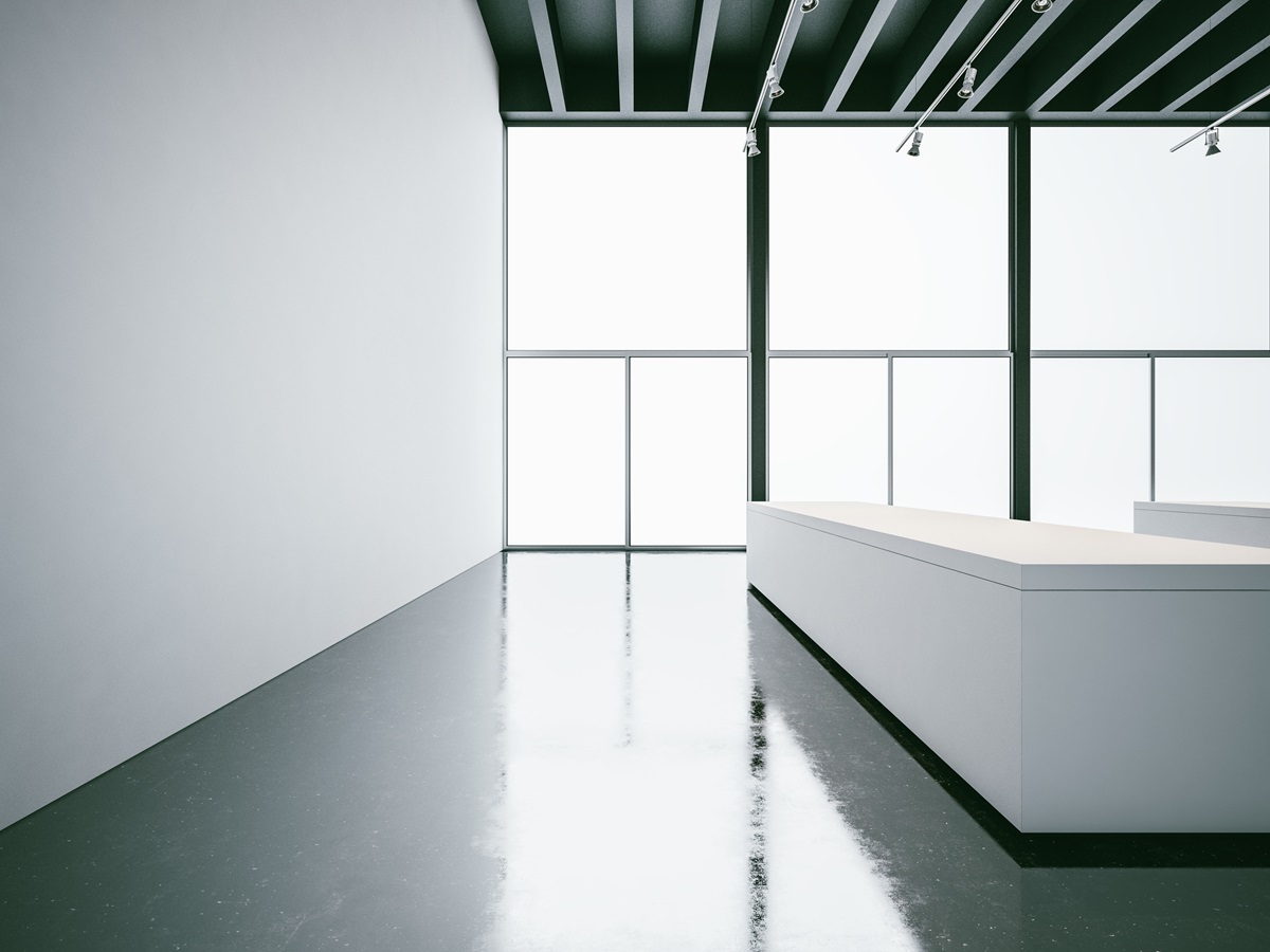 white gallery interior with concrete floor